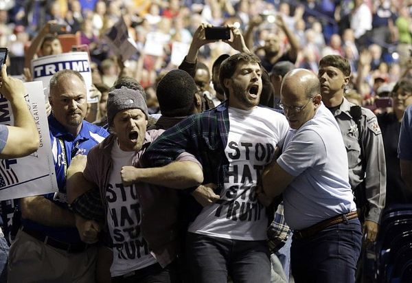 Trump rally goer charged with hitting black attendee