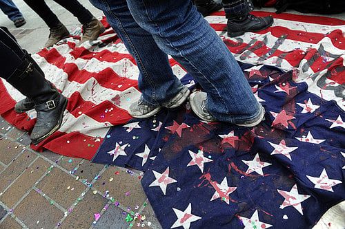Students at Brown and other colleges desecrate flag to protest Trump