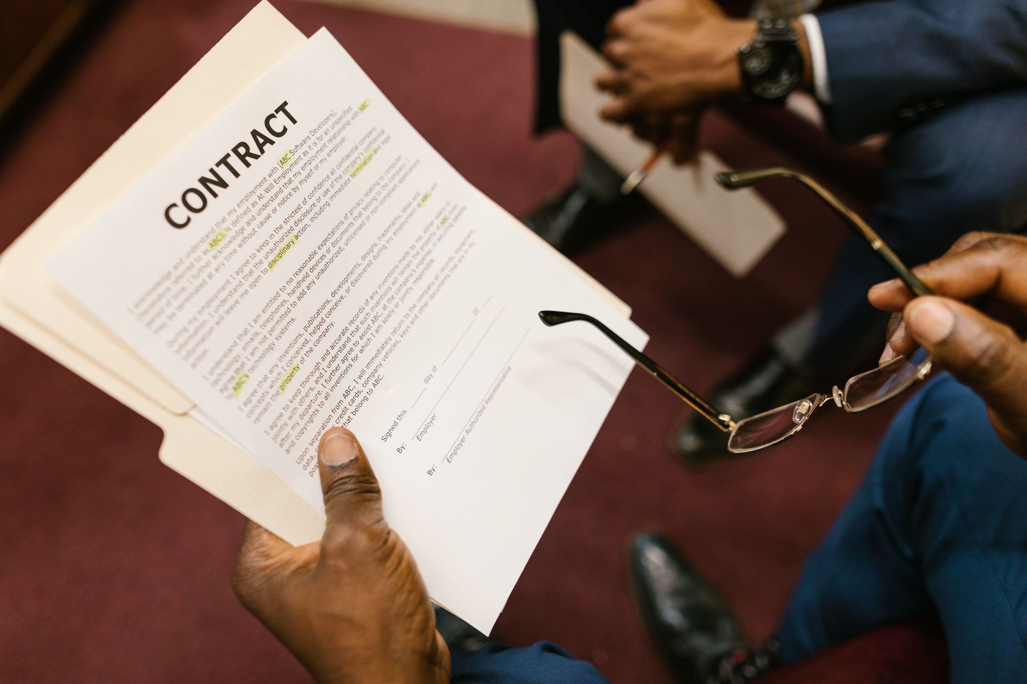Professionals reviewing a contract document together