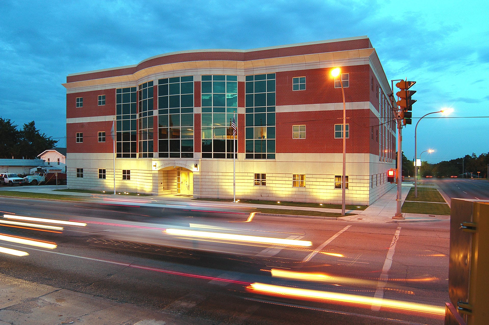 Front facade of the Payne County Administration Building at dusk.