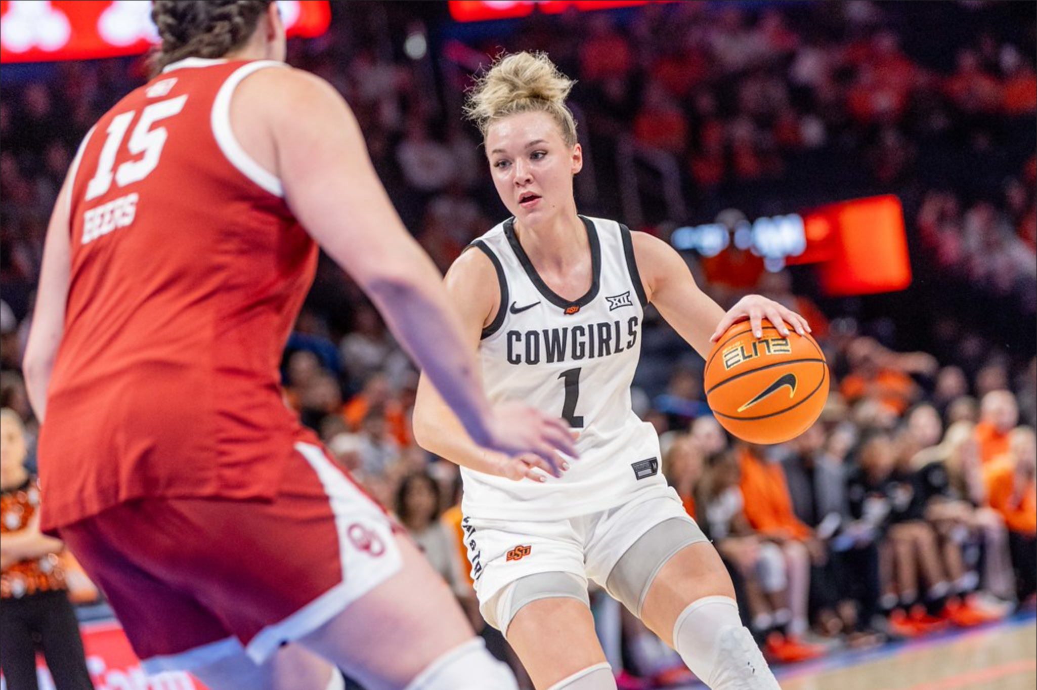 Oklahoma State guard Amari Whiting (1) dribbles against an Oklahoma defender during the Cowgirls' game on December 13, 2025 at Paycom Arena.