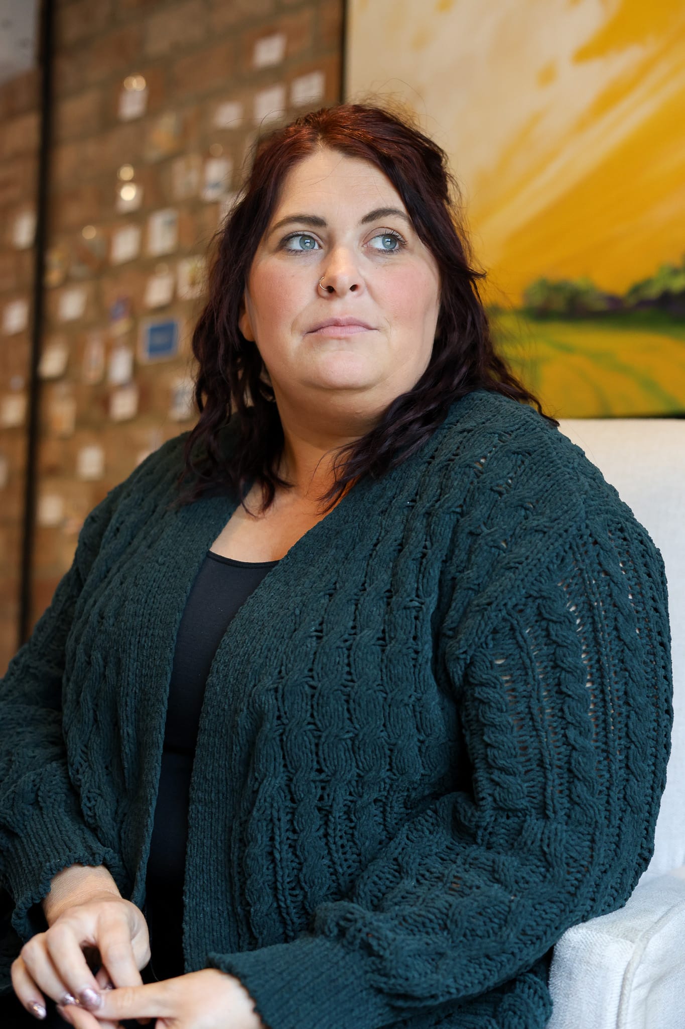 Heather Houle, executive director of The Saville Center, sits for a portrait at the Medical Cottage where she has led the organization for three and a half years.