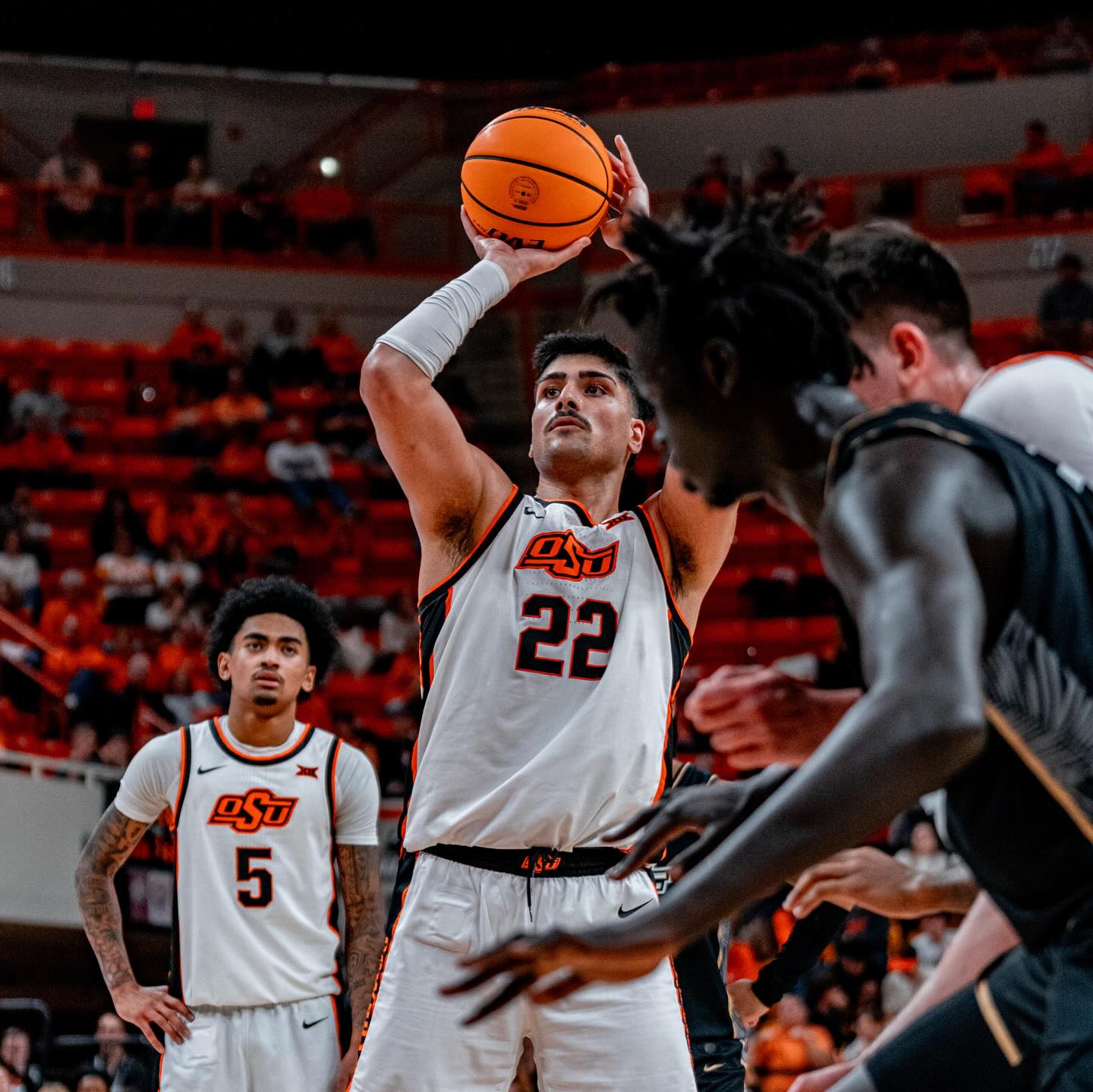 OSU center Parsa Fallah (22) shoots a free throw during Cowboys' 87-76 win over No. 25 UCF Tuesday at Gallagher-Iba Arena. Fallah led all scorers with 24 points. Photo Courtesy OSU Athletics.