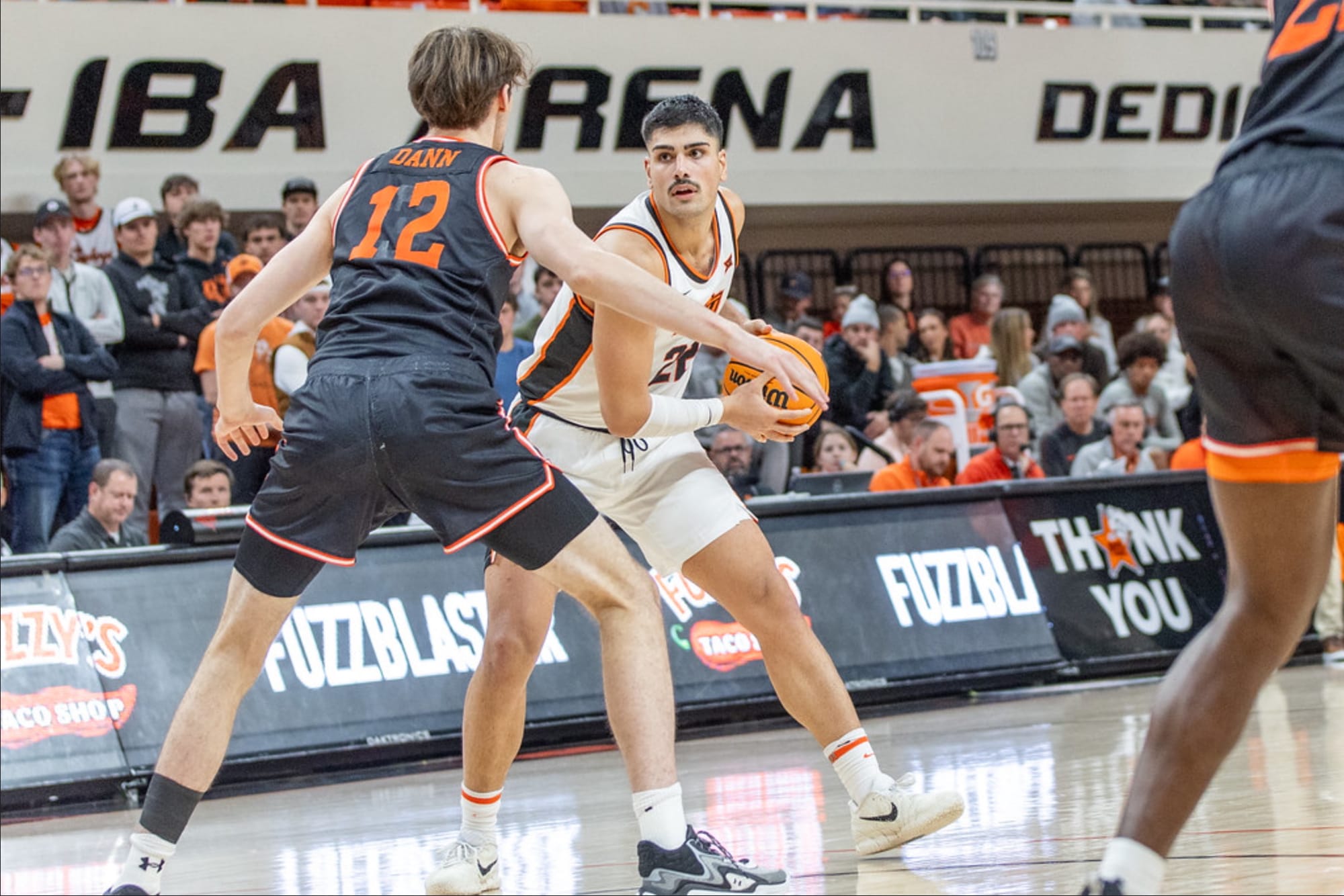 Oklahoma State center Parsa Fallah (22) handles the ball against Sam Houston defender Matt Dann (12) during the Cowboys' game Dec. 2, 2025 at Gallagher-Iba Arena in Stillwater, Oklahoma