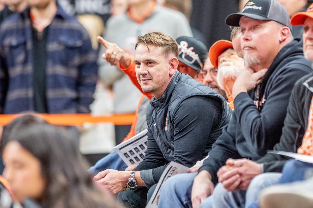 Oklahoma State football head coach Eric Morris watches from the stands at Gallagher-Iba Arena during the Cowboys wrestling dual against Oklahoma.