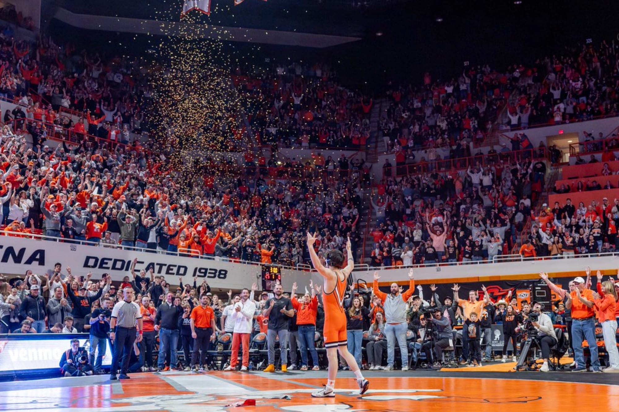Golden confetti rains down as Oklahoma State freshman Jax Forrest celebrates his first collegiate pin before a sold-out Gallagher-Iba Arena crowd during the Cowboys' Bedlam win Jan. 11, 2026.