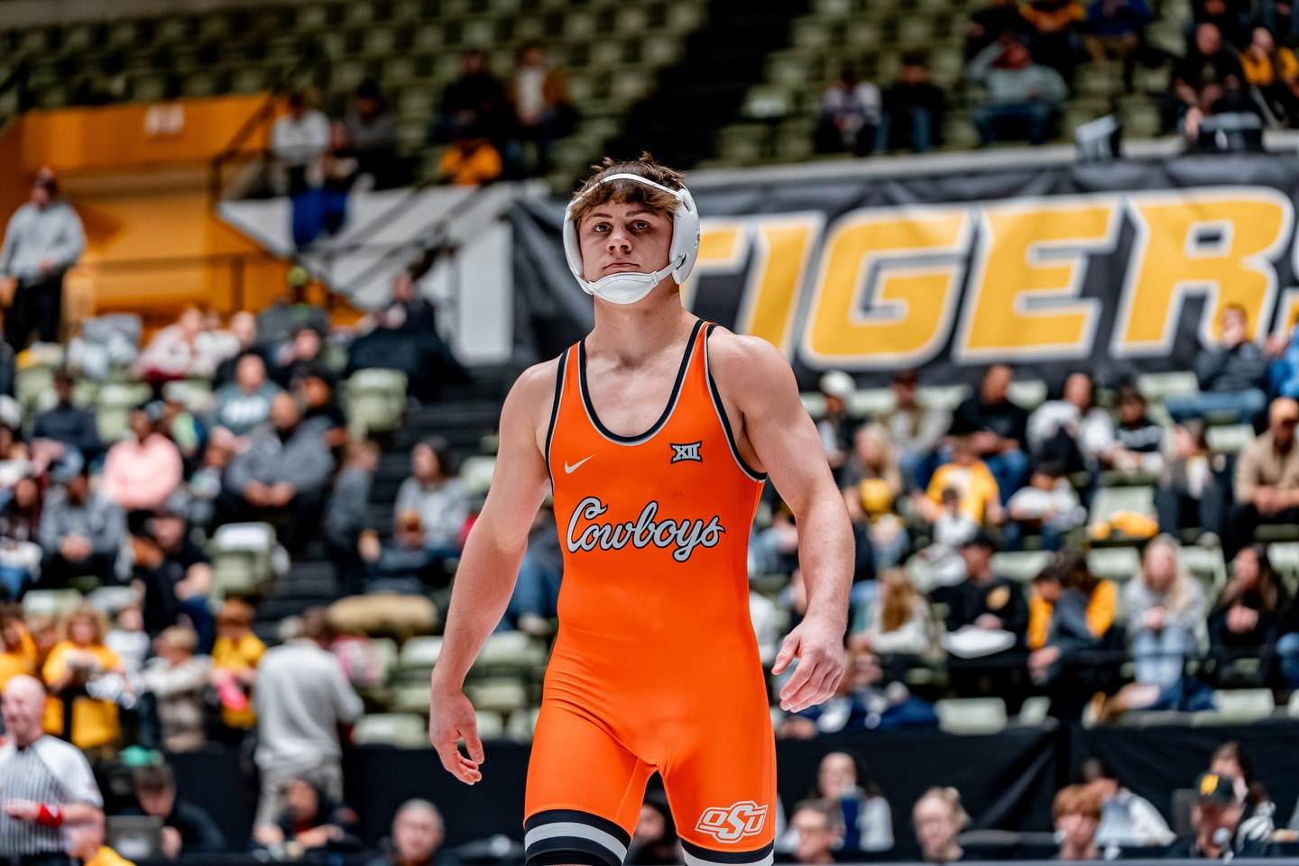 OSU freshman wrestler Landon Robideau in orange Cowboys singlet stands on mat at Hearnes Center during 157-pound bout against Missouri in Cowboys 33-3 dual meet victory Jan. 23, 2026