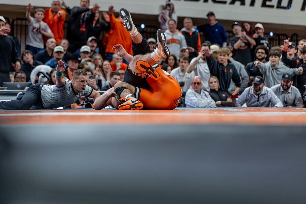 OSU's Konner Doucet tilts Iowa's Gage Marty onto his back for the pin as the GIA crowd reacts during the Cowboys' 32-11 win on Feb. 22, 2026.