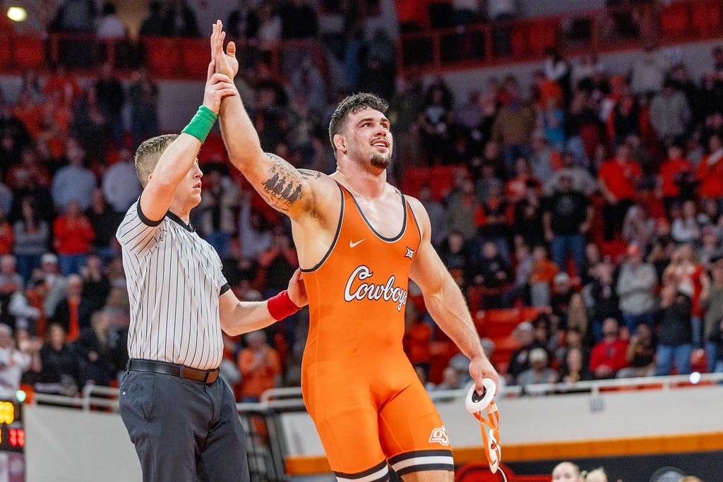 OSU heavyweight Konner Doucet has his hand raised by the referee after pinning Iowa's Gage Marty in his final home match on Feb. 22, 2026.
