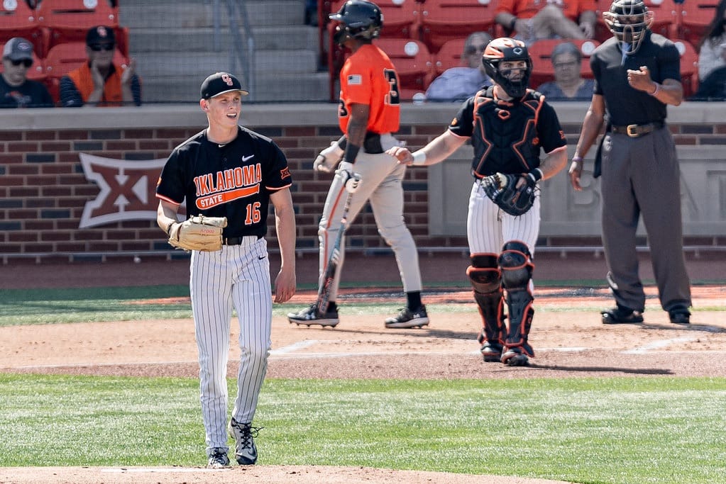 Oklahoma State pitcher Ethan Lund (16) smiles walking off the mound after a strikeout against Sam Houston State at O'Brate Stadium, Feb. 28, 2026.