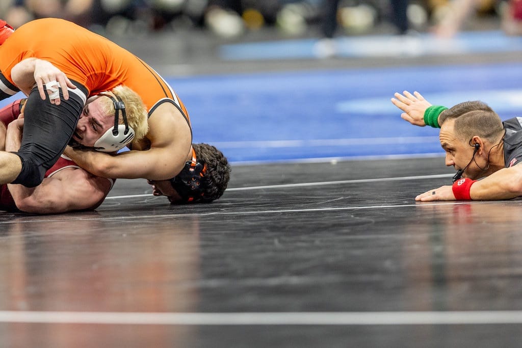 Oklahoma State's Sergio Vega works toward a pin against Rider's Elijah Griffin in the 141-pound second round of the 2026 NCAA Wrestling Championships.