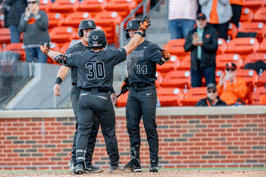 OSU's Brady Francisco (30) is greeted at home plate by teammates after a two-run home run against Oral Roberts, Tuesday, April 7, 2026, at O'Brate Stadium in Stillwater.