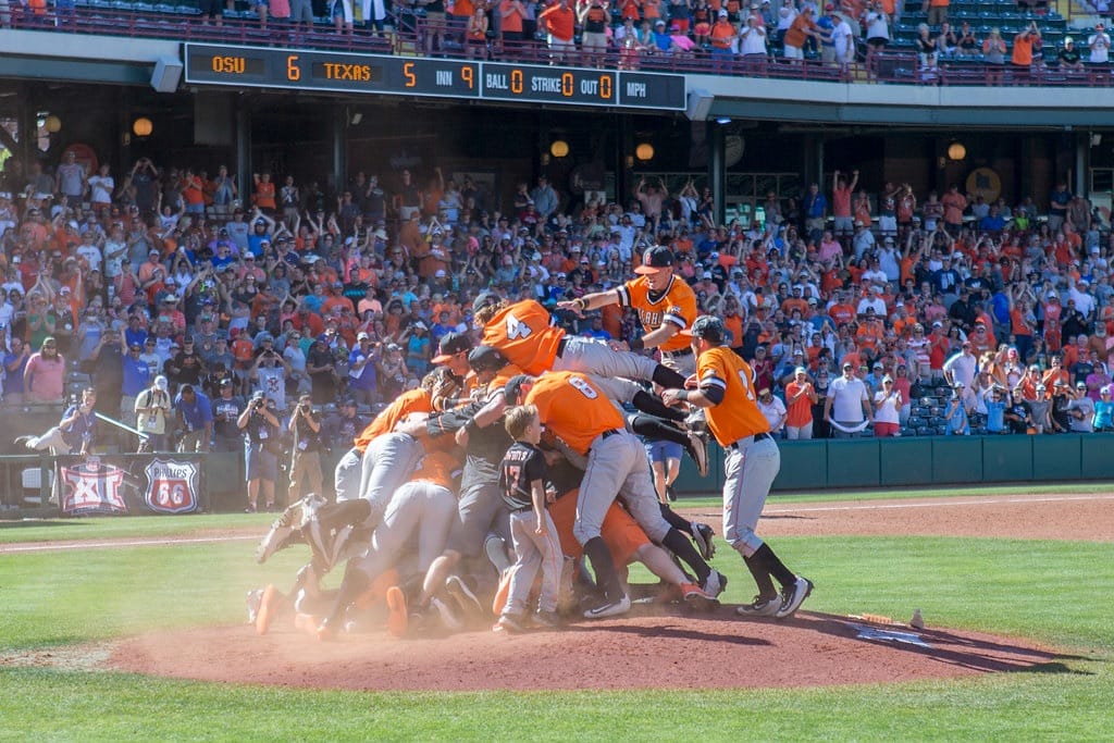 OSU players dog-pile on the mound after defeating Texas 6-5 in the 2017 Big 12 Baseball Championship at Chickasaw Bricktown Ballpark in Oklahoma City on May 28, 2017.