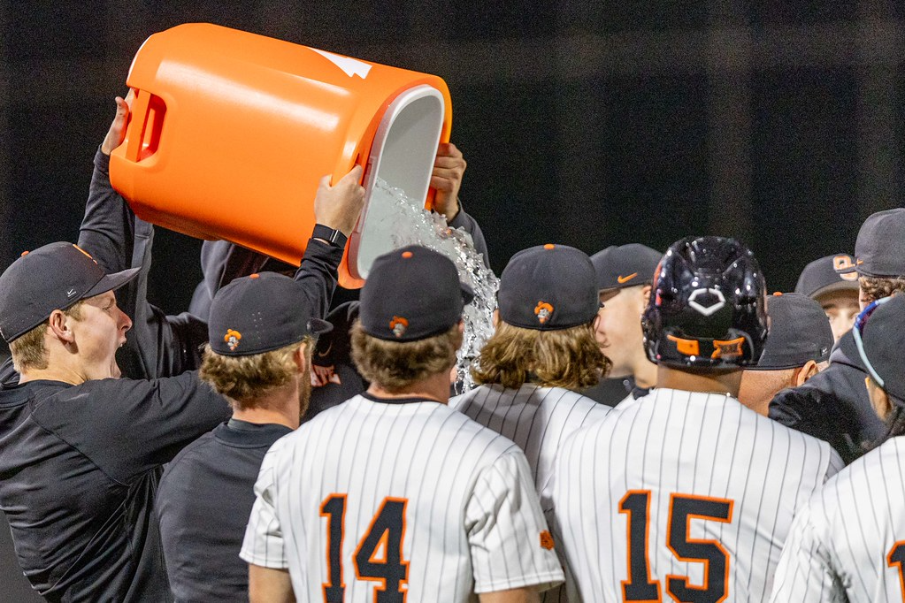 OSU players pour a Gatorade bath on head coach Josh Holliday after a 14-4 run-rule win over Wichita State at O'Brate Stadium in Stillwater on April 21, 2026, his 500th career win.
