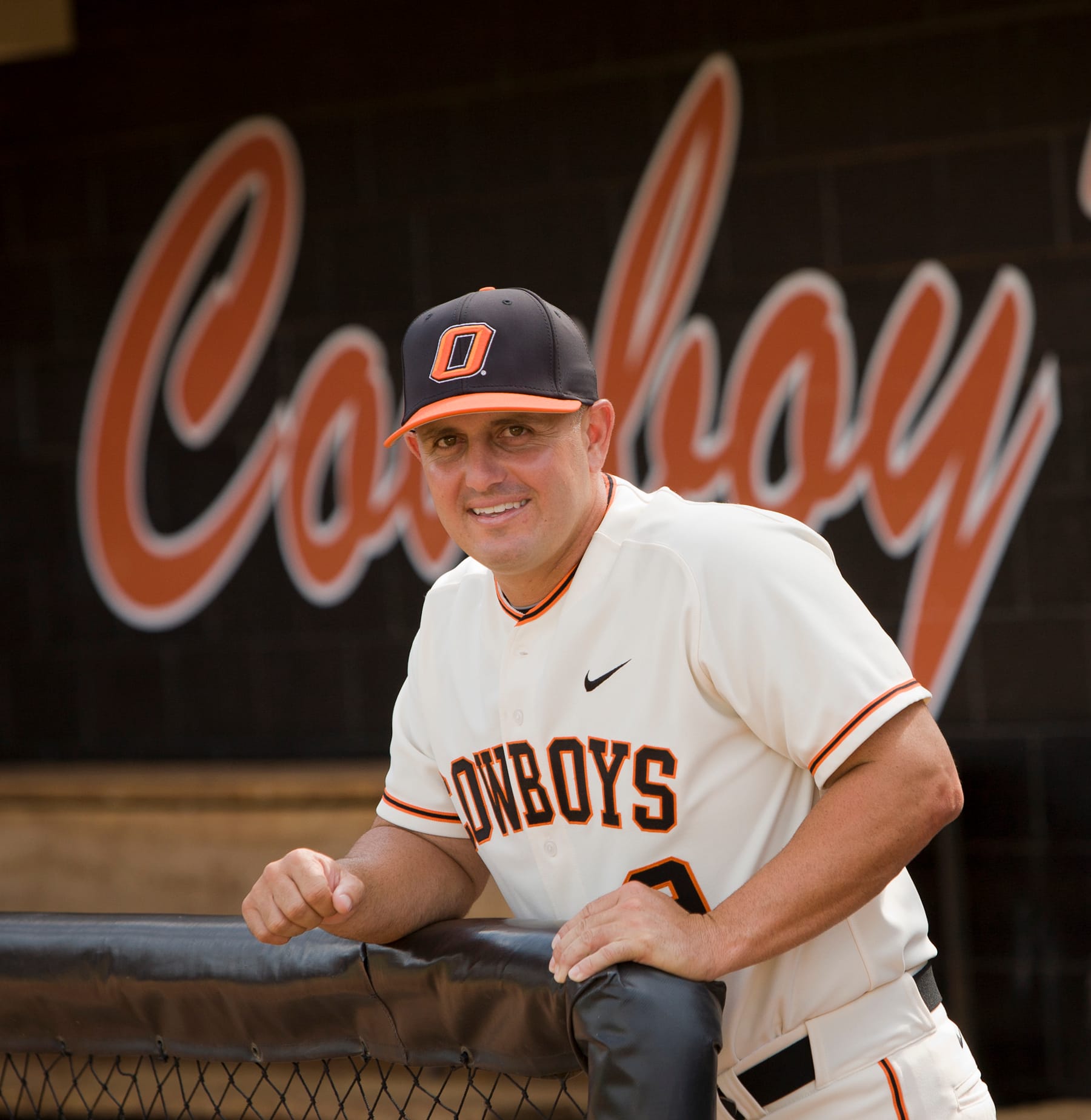 OSU head coach Josh Holliday poses for a portrait in the dugout at Allie P. Reynolds Stadium in Stillwater on July 5, 2012, ahead of his first season as head coach.