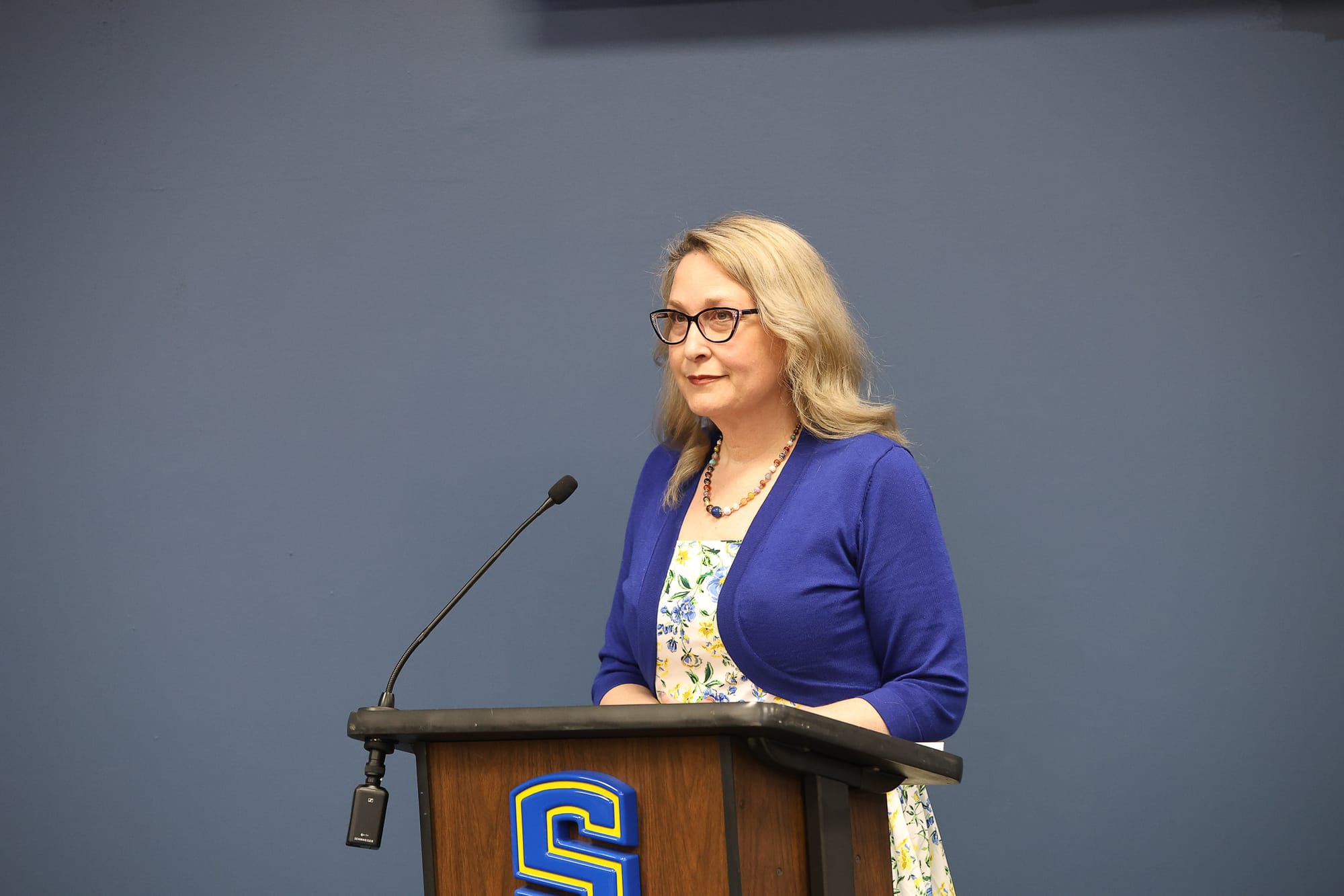 Rachel Dillin speaks at the podium during the Stillwater Board of Education regular meeting April 14, 2026, at the Stillwater Public Schools Administration Building.