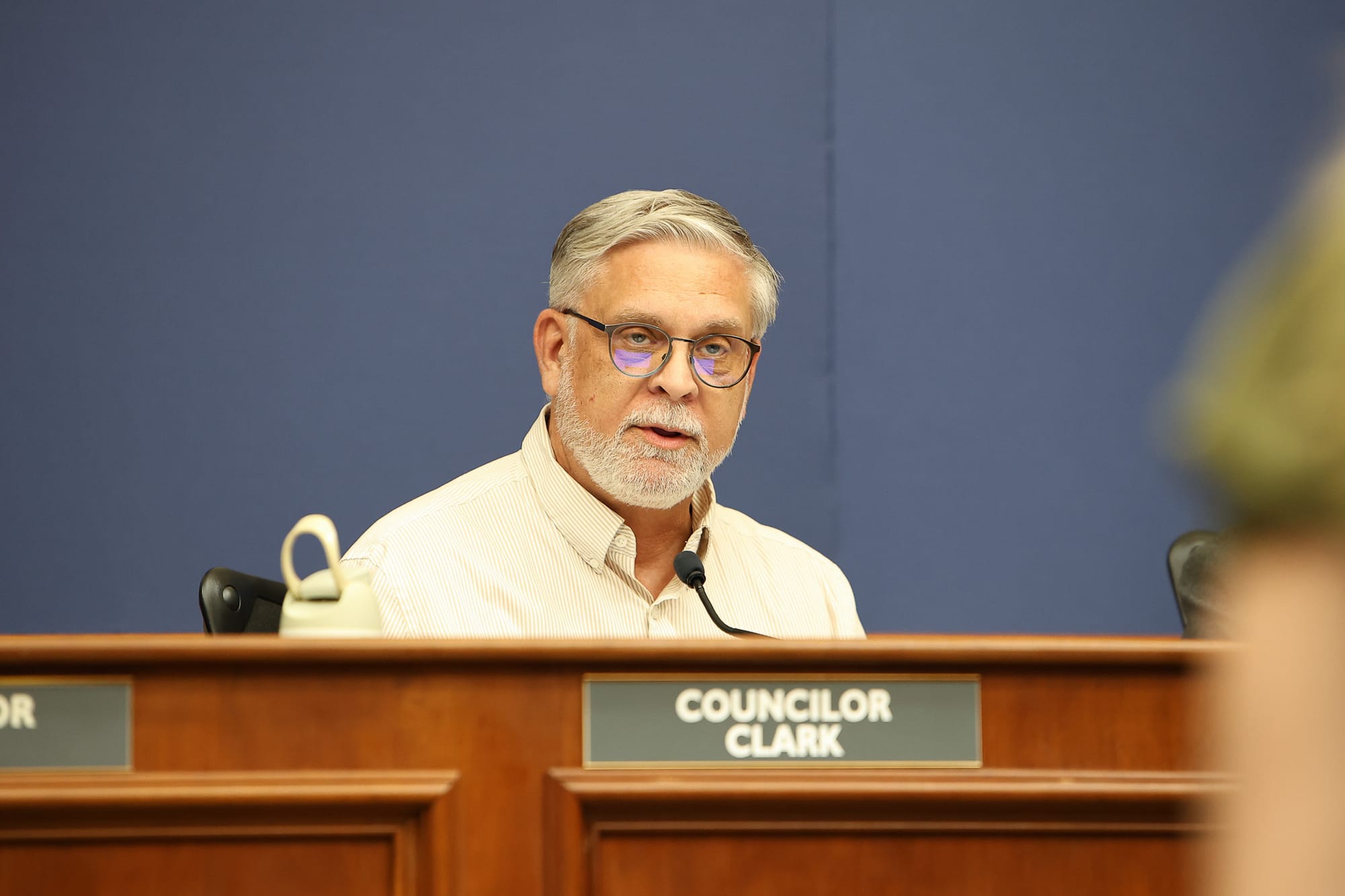 Stillwater City Councilor Kevin Clark speaks at the council dais during the April 6, 2026 city council meeting. 