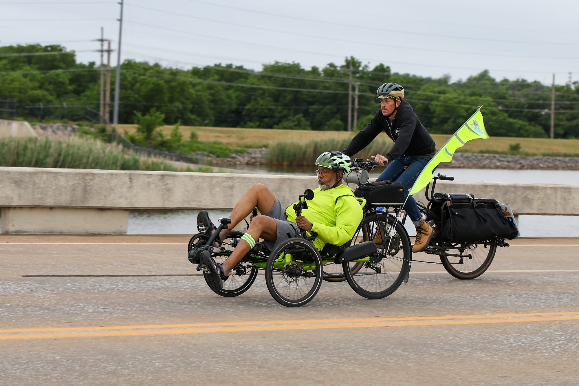 Udaya DeSilva rides a recumbent trike alongside Seth Woods on the Lakeview Road bridge during Stillwater's Ride of Silence on May 20, 2026.