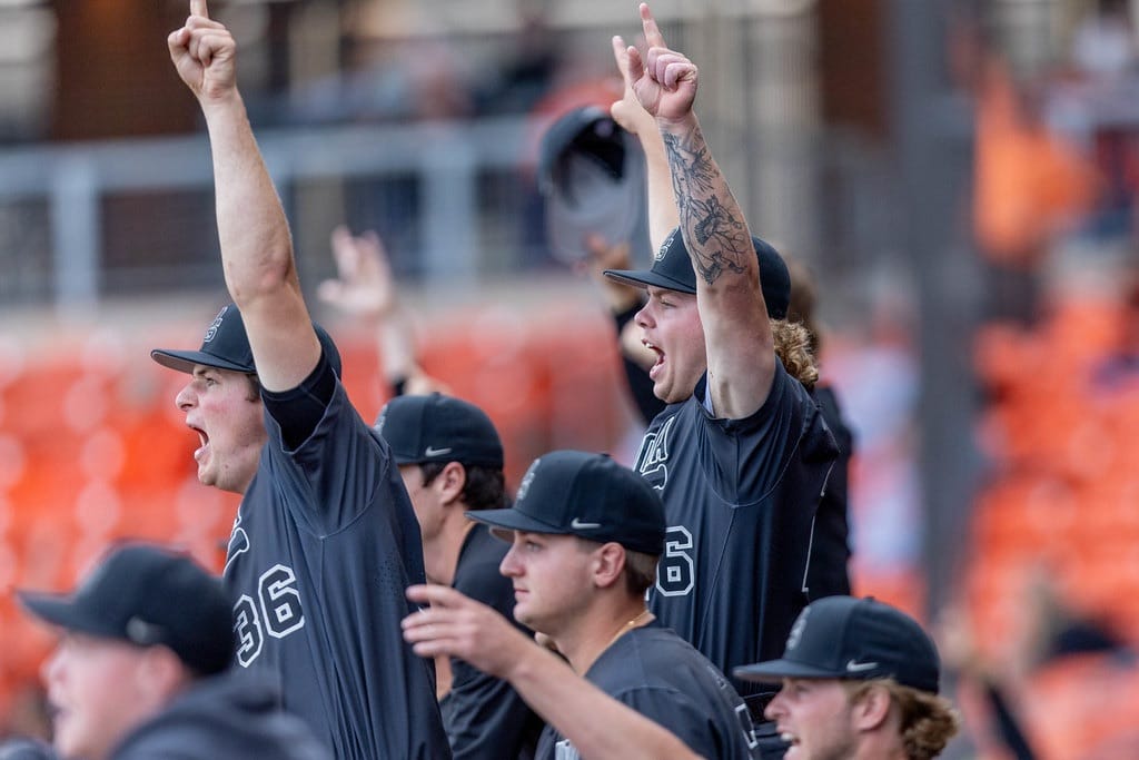 Oklahoma State's Hudson Barrett and Noah Wech celebrate in the dugout during a 7-6 win over TCU on May 1, 2026, at O'Brate Stadium in Stillwater.