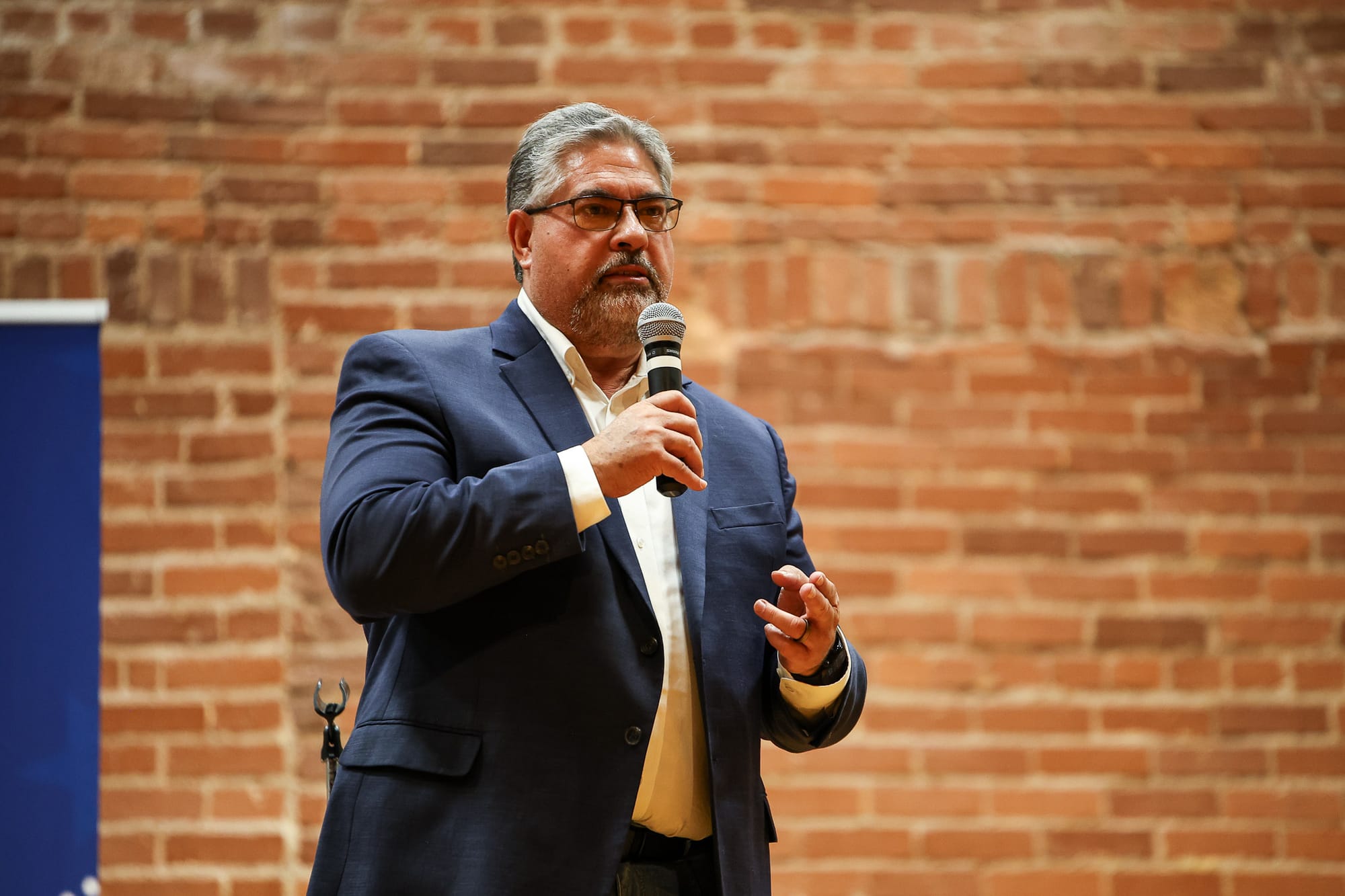 Kevin Wright speaks into a microphone at the Payne County GOP candidate forum on June 11, 2026, at the Stillwater Community Center in Stillwater.