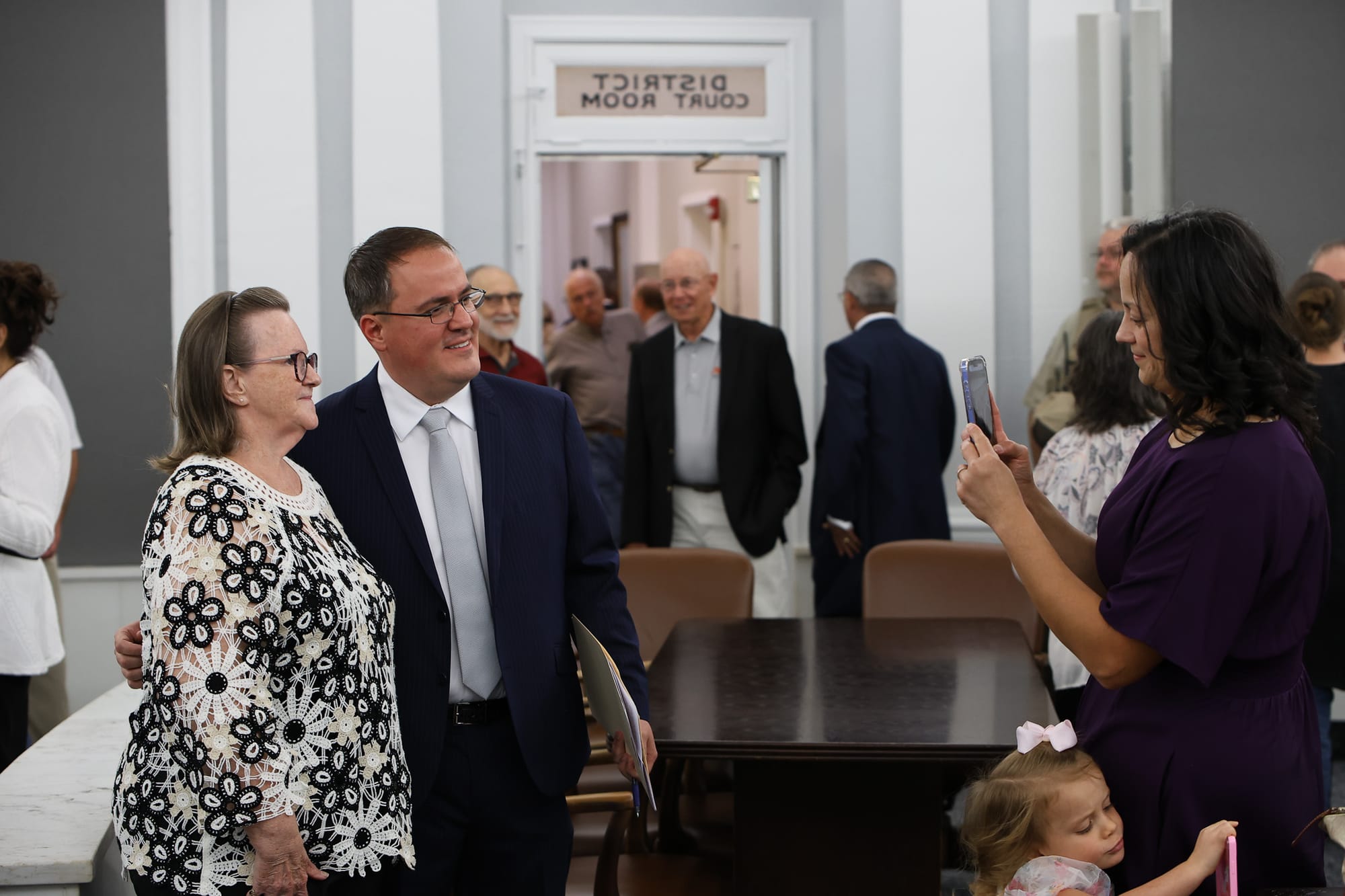 District 9 DA Jeremiah Gregory poses with former teacher Patricia Walters after his swearing-in ceremony July 31, 2026, at the Payne County Courthouse in Stillwater.