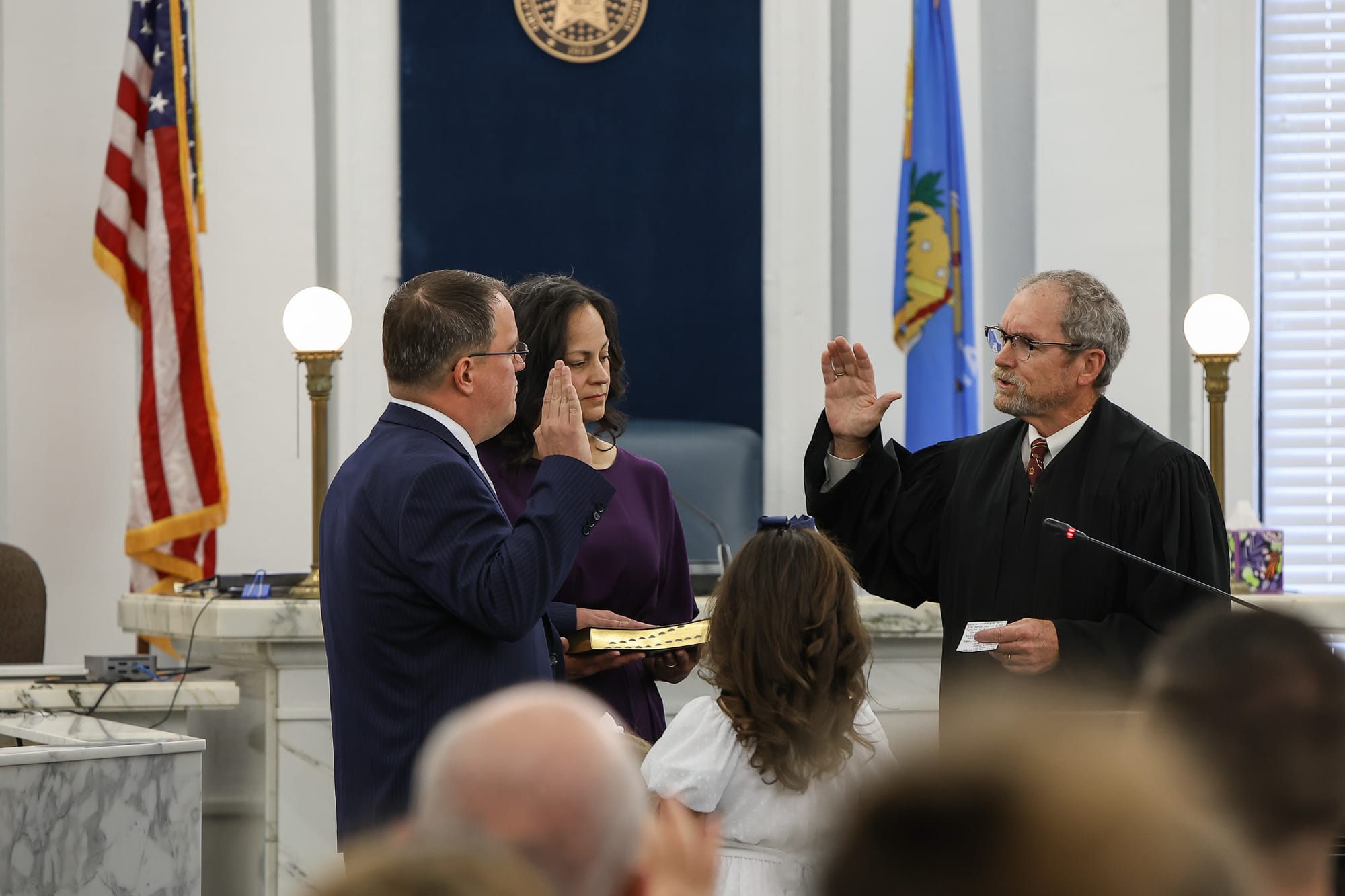 Jeremiah Gregory raises his right hand as Judge Robert Hudson administers the oath of office July 31, 2026, in the Payne County Courthouse in Stillwater, as his family looks on.