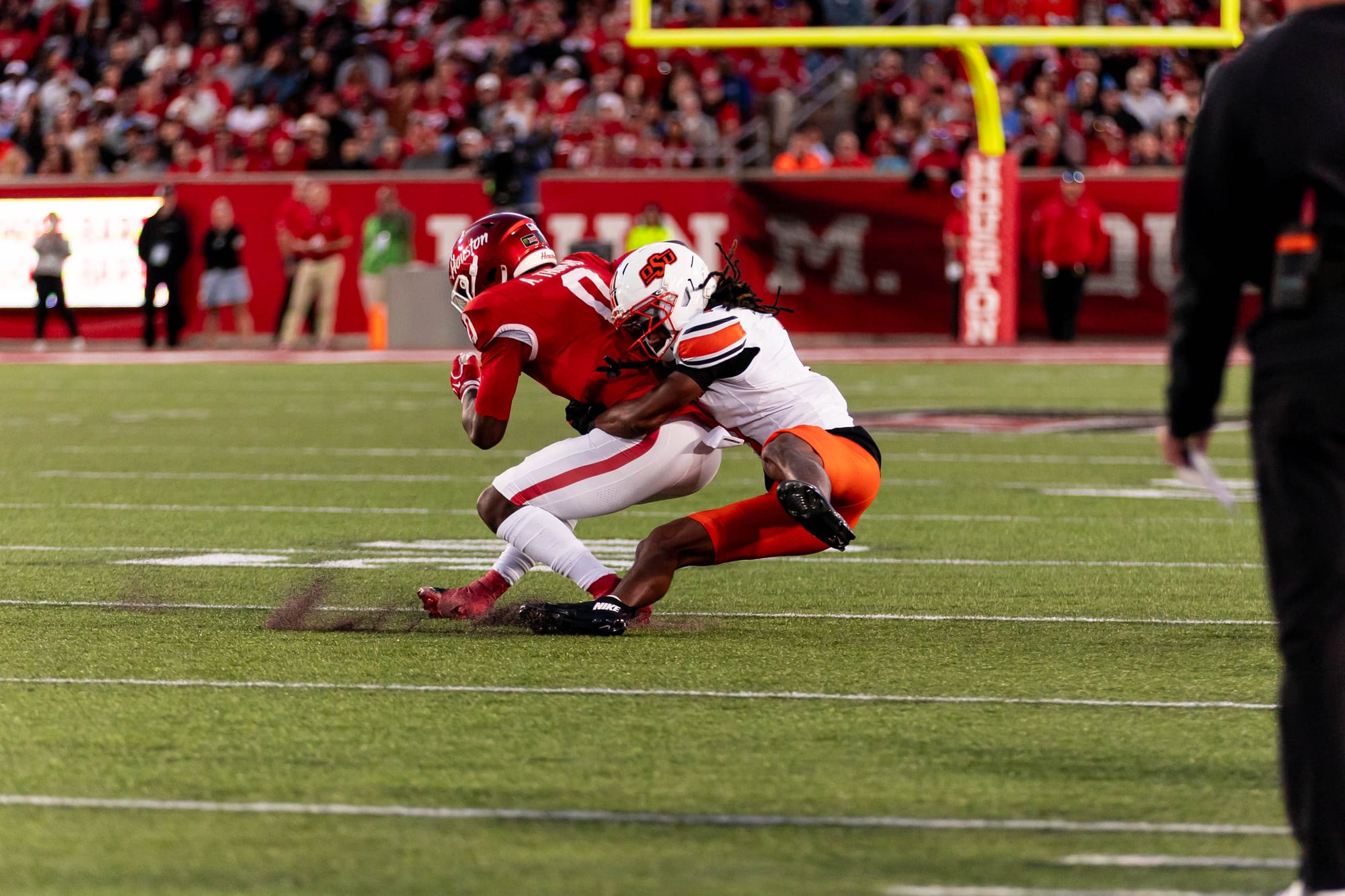 OSU safety Evan Jackson tackles Houston wide receiver Amare Thomas after a catch on Saturday, Oct. 17, 2026, at TDECU Stadium in Houston.