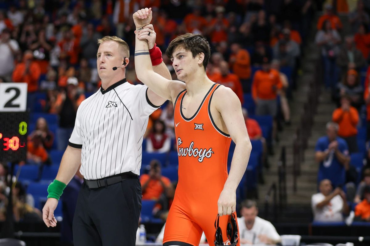 Cowboys lead Big 12 team race through first session, send 9 to semifinals