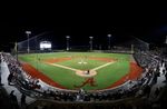 A wide view of Sewell-Thomas Stadium in Tuscaloosa, Ala., lit up for a night game. The venue hosts the 2026 Tuscaloosa NCAA Baseball Regional beginning May 29.