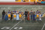 Stillwater High’s 2026 homecoming court and escorts stand near midfield at Pioneer Stadium, with crowned king Kyle Stokes (23) and queen Daisy Goff at center, before Friday’s game.