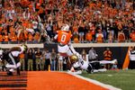 OSU wide receiver Justin Bowick steps into the end zone on a touchdown catch as a Colorado defender dives behind him on Oct. 24, 2026, at Boone Pickens Stadium.