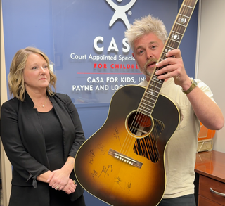 CASA for Kids Faces $50K Shortfall as Guitar Raffle Aims to Bridge Gap