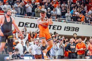 OSU heavyweight Konner Doucet celebrates after pinning Iowa's Gage Marty, clinching the Cowboys' 32-11 victory Feb. 22, 2026, at Gallagher-Iba Arena. 