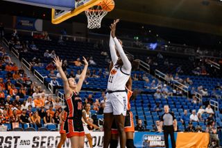 OSU forward Achol Akot (11) rises for a shot over Princeton defenders during the Cowgirls' 82-68 NCAA Tournament first-round win at Pauley Pavilion.