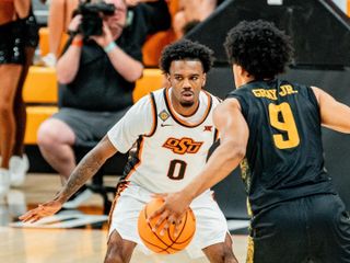 OSU guard Jaylen Curry (00) plays defense against Wichita State in a 96-70 NIT second-round loss at Gallagher-Iba Arena in Stillwater.