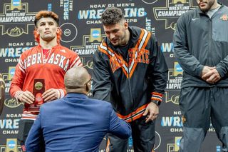 Konner Doucet of Oklahoma State stands on the podium at the 2026 NCAA Wrestling Championships, finishing fourth at heavyweight in Cleveland.