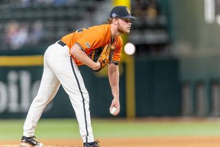 OSU pitcher Brennan Phillips in set position on the mound against Oklahoma, Feb. 14, 2026, Globe Life Field, Arlington, Texas.