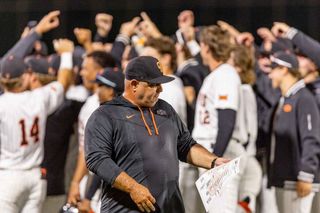 OSU head coach Josh Holliday walks among celebrating players after his 500th career win, a 14-4 run-rule victory over Wichita State at O'Brate Stadium in Stillwater on April 21, 2026.