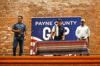 From left, Zach Cavett, Ray Harper, and Jacob Presuhn stand on stage at the Payne County GOP candidate forum on June 11, 2026, at the Stillwater Community Center in Stillwater.