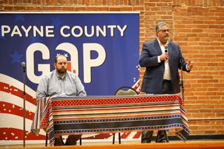 Rep. Dillon Travis listens as challenger Kevin Wright speaks at the Payne County GOP candidate forum on June 11, 2026, at the Stillwater Community Center in Stillwater.