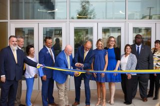 District officials, staff and board members cut a yellow ribbon at the entrance of the new Stillwater High School on Thursday, July 30, 2026, at 410 W. Franklin Lane.
