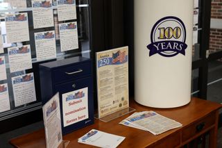 A display near the Stillwater Public Library's southwest entrance holds America 250 nomination narratives, a ballot box and the time capsule that will store the winning books.