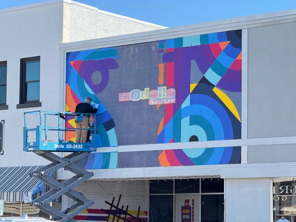 VIDEO: Local Artist Brings New Life to Modella Art Gallery with Vibrant Mural