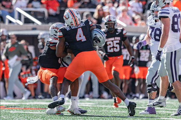 Oklahoma State edge rusher Wendell Gregory (4) rushes the passer during a game against Kansas State at Boone Pickens Stadium in Stillwater, Oklahoma.