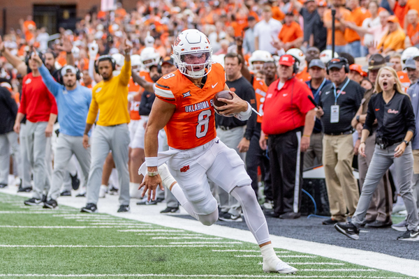 Quarterback Hauss Hejny (8) runs with the football during the Cowboys' season opener against UT-Martin at Boone Pickens Stadium on Aug. 28, 2025, before his season-ending injury.