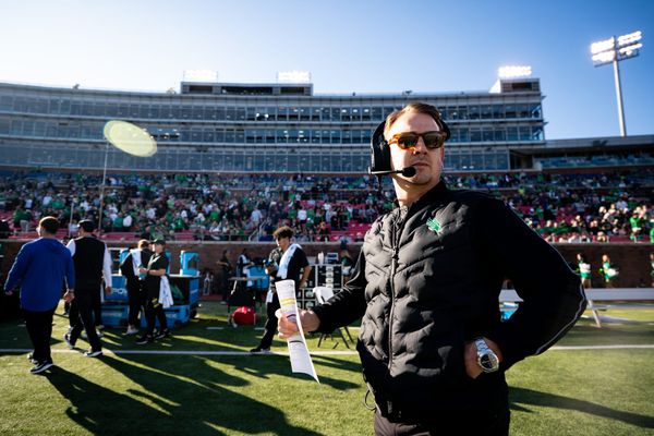 North Texas head coach Eric Morris on sideline wearing headset and sunglasses during First Responders Bowl against Texas State on Jan. 3, 2025