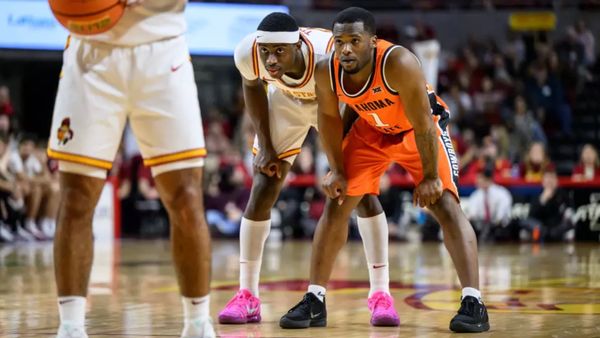 owa State's Killyan Toure and Oklahoma State's Kayne Clary stand in defensive positions during the Cyclones' 83-71 win at Hilton Coliseum.
