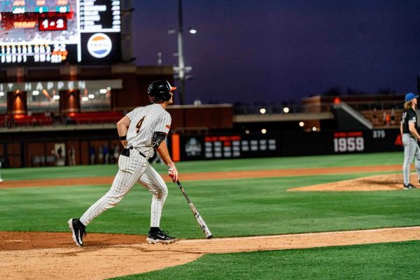 Oklahoma State catcher Campbell Smithwick (4) watches his walk-off home run leave the park in the bottom of the ninth inning against South Dakota State at O'Brate Stadium on Wednesday.