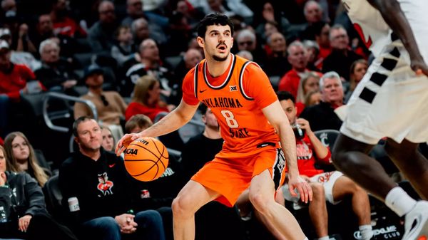 OSU freshman guard Daniel Guetta (8) dribbles against Cincinnati on Feb. 28, 2026. Guetta scored 11 points in OSU's NIT win over Davidson.