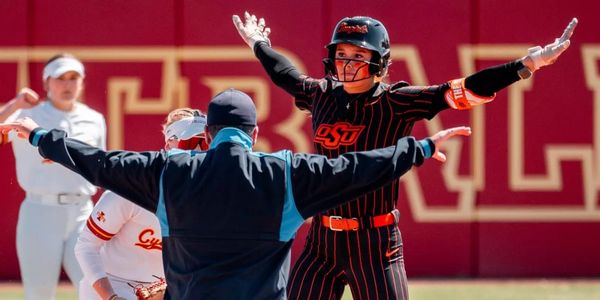 OSU freshman Aubrey Jones reacts after reaching base during the Cowgirls' series at Iowa State in Ames, Iowa, April 10-12, 2025.